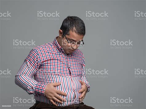 Overweight Man Holding Pot Belly Stock Photo Download Image Now