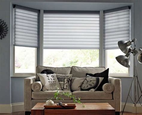 Living Room Bay Windows Decorated With Grey Blinds Window