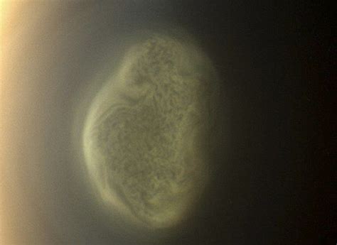 Mysterious 200 Mile High Vortex Boils Up Over Saturns Moon Titan And Could Offer Insight