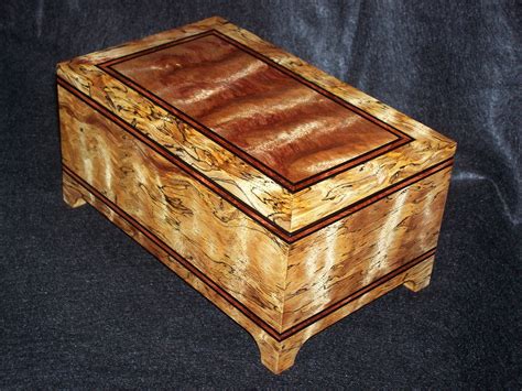 Exotic wood hardwood box with beautifully hand created out of wood from