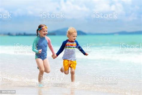 Kids On Tropical Beach Children Playing At Sea Stock Photo Download