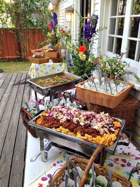 The varying heights also make the display more aesthetically interesting. Rustic wedding buffet with vintage tablecloths. bbq pork ...