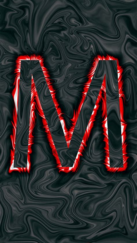 Download A Red And Black Letter M On A Black Background Wallpaper