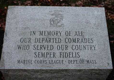 A Memorial Stone With The Words In Memory Of All Our Deployed Comrades Who Served Our Country