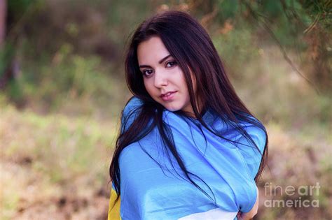 Beautiful Brunette Model Posing In A Park With Flag Of Ukraine