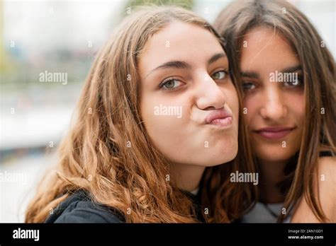 Friends embracing outdoors Stock Photo - Alamy