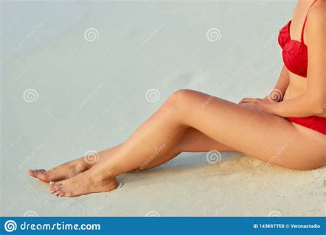 Sexy Suntan Bikin Woman Legs Relaxing Lying Down Near Beach In Resort