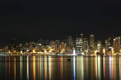 Seattle City Skyline At Night With Lights Reflected In Water Stock