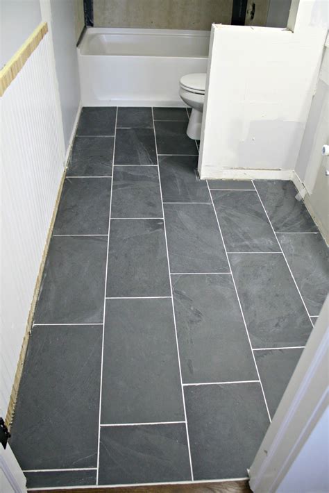 If you have a low ceiling but a wider floor space, you may like to choose this. How to tile a bathroom floor (it's done!) | Grey bathroom ...