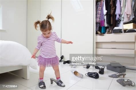 Young Girl Trying On Her Mothers Shoes High Res Stock Photo Getty Images