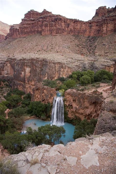 A Blue Waterfall Wets The Arid Landscape Of The Grand Canyon Az