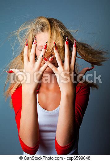 Pictures Of Blonde Girl With Hair Fluttering On Wind Hiding Her Face By