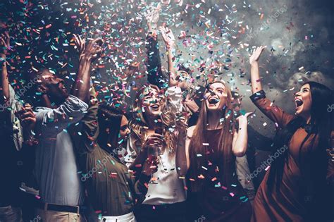 People Dancing At Party With Confetti — Stock Photo © Gstockstudio