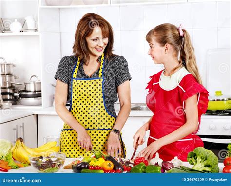 Mother And Daughter Cooking At Kitchen Stock Image Image Of Chair