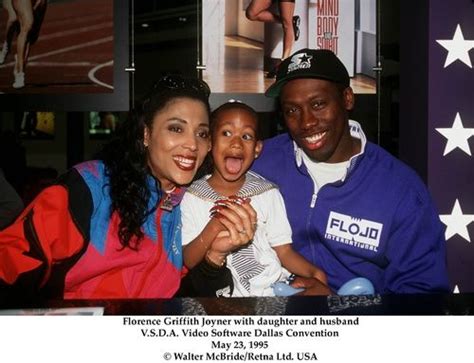 She is the fastest woman of all time; Flo jo with family | Flo jo, Track and field, Women in history