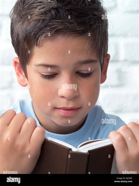 Portrait Of Boy Reading Book Stock Photo Alamy