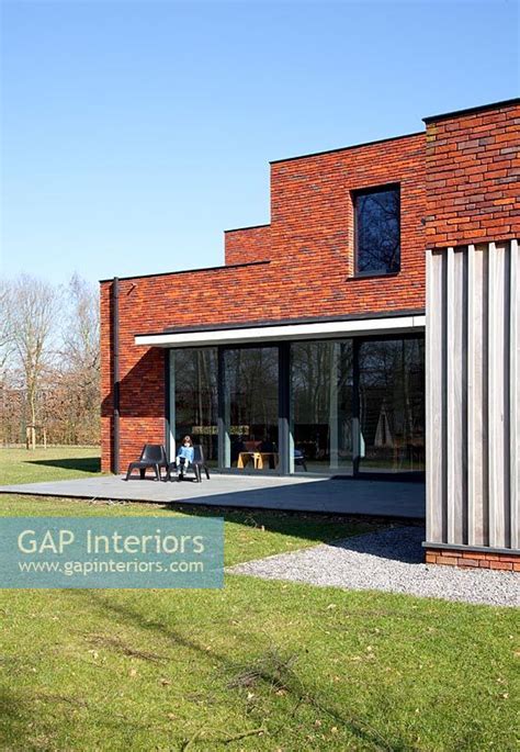 Gap Interiors Modern Red Brick House Exterior Image No