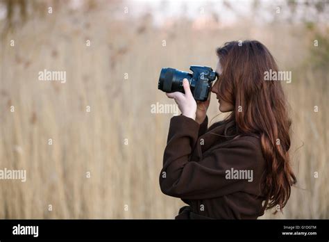 Portrait Of Attractive Teenage Girl With Camera Stock Photo Alamy
