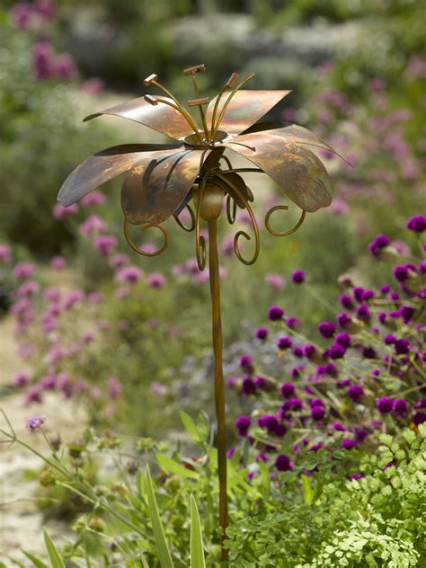 Moonflowers or columbine are especially effective for this, with their delicate vines and beautiful blooms. Metal Garden Flowers Stakes | Fasci Garden
