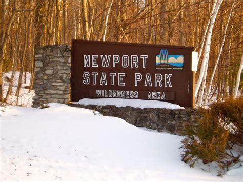 A Sign That Reads Newport State Park Wilderness Area In Front Of Some