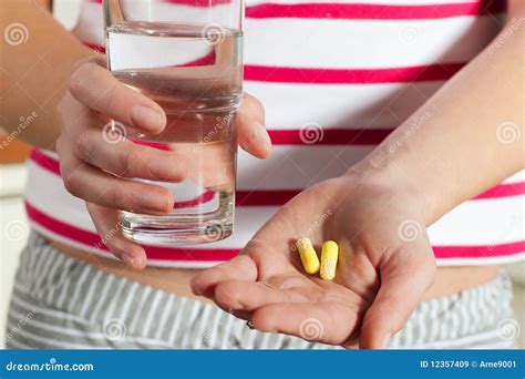 Woman Holding Pills In Her Hands Stock Image Image Of Capsule Yellow