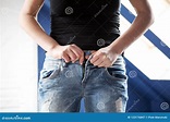 Woman Pulling On Tight Jeans Stock Image - Image of dieting, beautiful ...