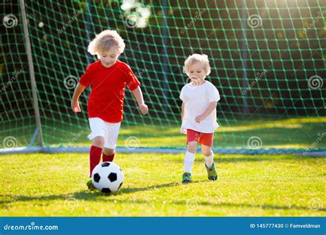 Kids Play Football Child At Soccer Field Stock Photo Image Of