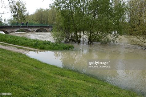 People Stand On A Bridge Over The Ouche River On May 4 In News Photo