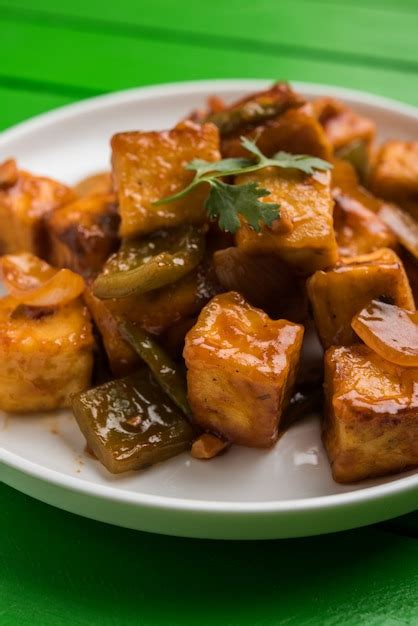 Premium Photo Chilli Paneer Or Spicy Cottage Cheese Served In White