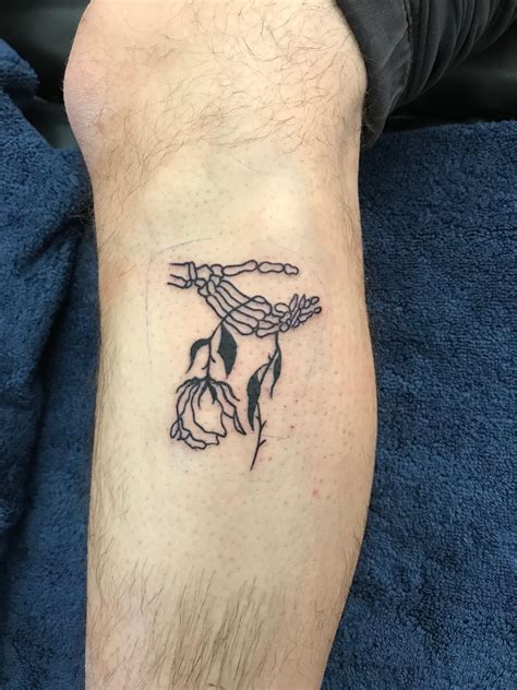 Forearm Skeleton Hand Holding Rose Tattoo Viraltattoo