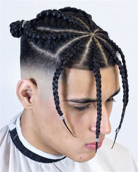 Braided Bun And Fade For The Sake Of Swag This Hairstyle Has Left A Few Dangly Braids At The