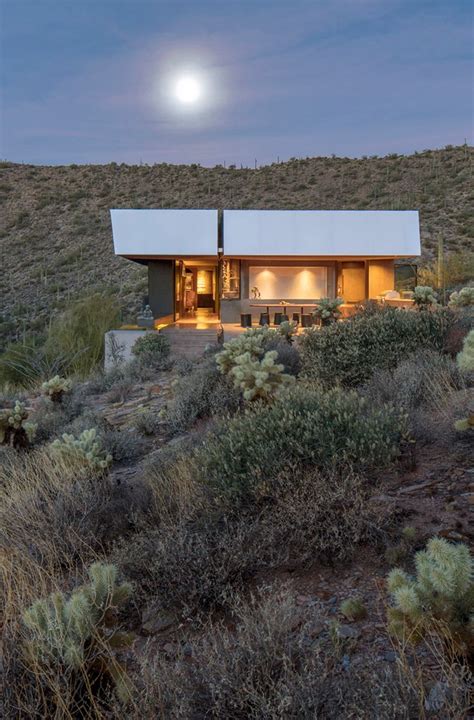 The Exterior Of A Modern Home In The Desert At Night With Full Moon
