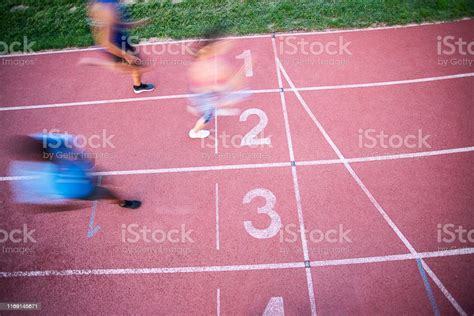Athletes Crossing The Finish Line Stock Photo Download Image Now