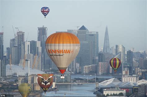 Hot Air Balloons Sail Past London Landmarks As They Take To The Skies