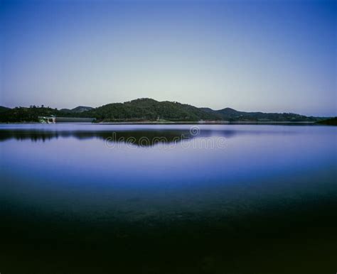 Hill And Landscape Reflecting In Lake Windamere Dam New South Wales