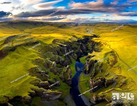 Aerial View Of Fjadrargljufur Canyon And River Flowing Along The Bottom