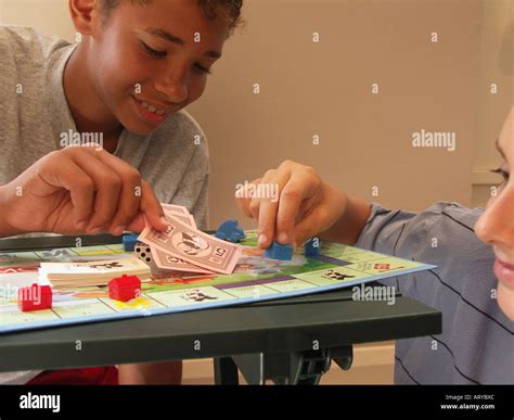 Young Boys Playing Board Game Stock Photo Alamy