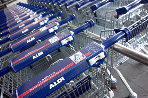 New Aldi Shopping Carts In A Row Stock Photo Download Image Now Istock