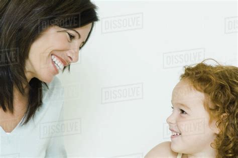 Mother Smiling At Babe Girl Cropped Stock Photo Dissolve