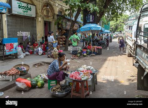 People On A Sidewalk And Street Selling Fruits In Mandalay Myanmar