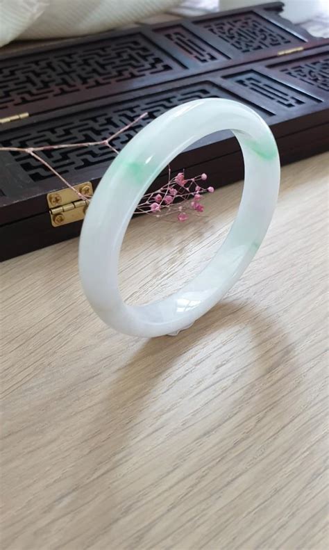 55mm Burmese Type A Icy Translucent White With Green Patch Oval Shape