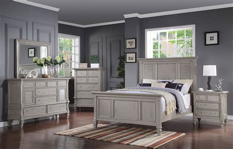 Modern style grey birch finish storage headboard padded leather headboard light above nightstands soft closing drawers by blum chrome accents measurements: Brimley 4-Piece Queen Bedroom Set - Grey | Levin Furniture