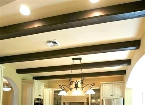 Diy faux ceiling beams straps getting creative with our fake ceiling beams, we wanted to find a way to make them look more like the real deal. faux ceiling beams styrofoam ceiling beams faux ceiling ...