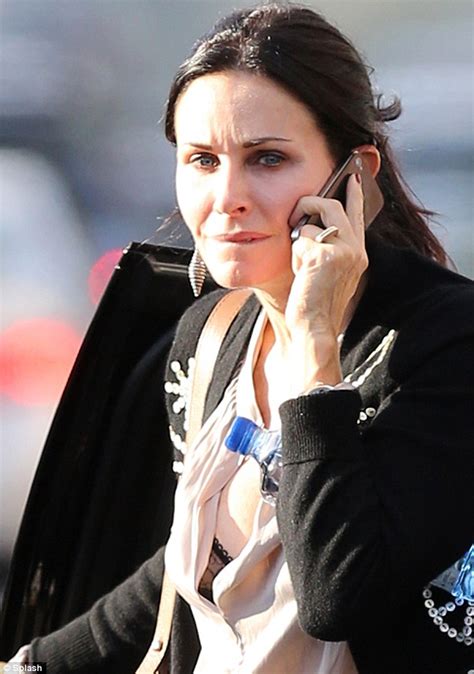 Courteney Cox Flashes Her Bra In A Daring Plunging Blouse As She