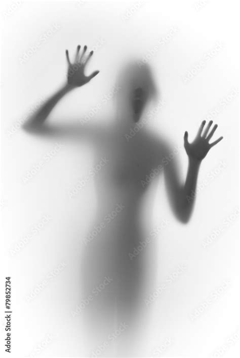 Shouting Scary Face And Body Silhouette Behind A Glass Surface Stock