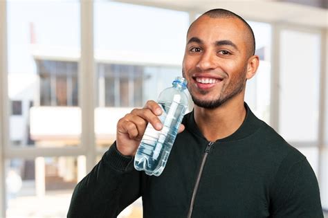 Premium Photo Young Cool Black Man Drinking Water