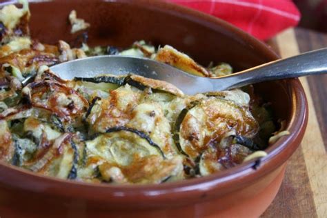 Place grated zucchini in a strainer, sprinkle with salt and squeeze out moisture from zucchini with a paper towel. Garlic Baked Zucchini with Cheese and Red Onion