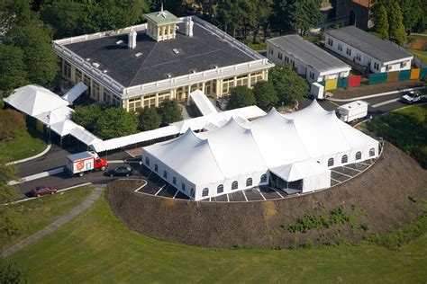 An Aerial View Of A Large White Tent In The Middle Of A Field With