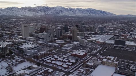 Orbit Of Snowy Downtown Salt Lake City Utah In Winter Aerial Stock