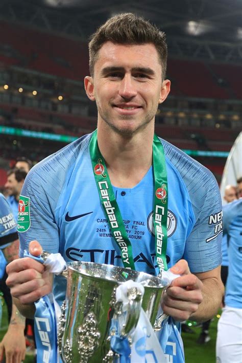 Aymeric Laporte Of Manchester City Celebrates With The Trophy After